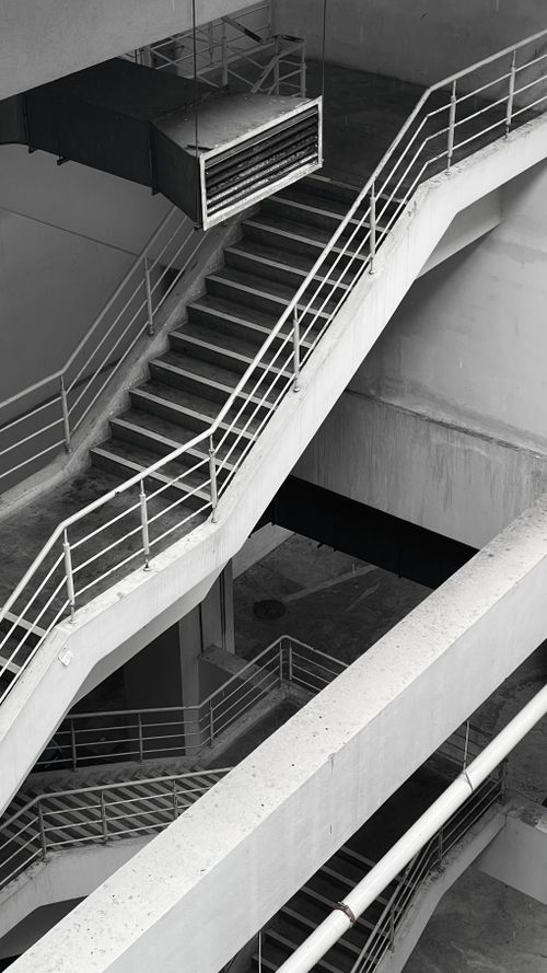 Free Grayscale image highlighting a modern concrete staircase in Selangor, Malaysia. Stock Photo