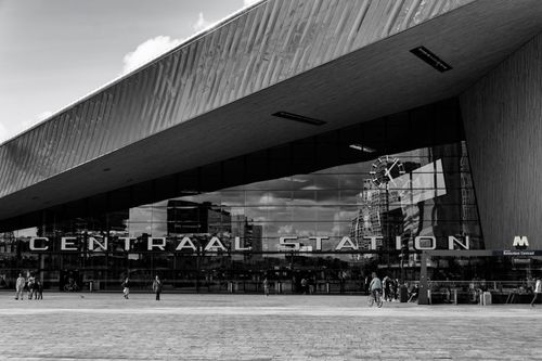 Free Black and white view of Rotterdam Central Station showcasing modern architecture. Stock Photo