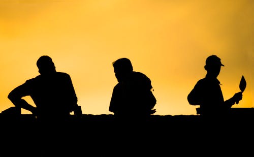 Foto profissional grátis de céu amarelo, construtores, empregados