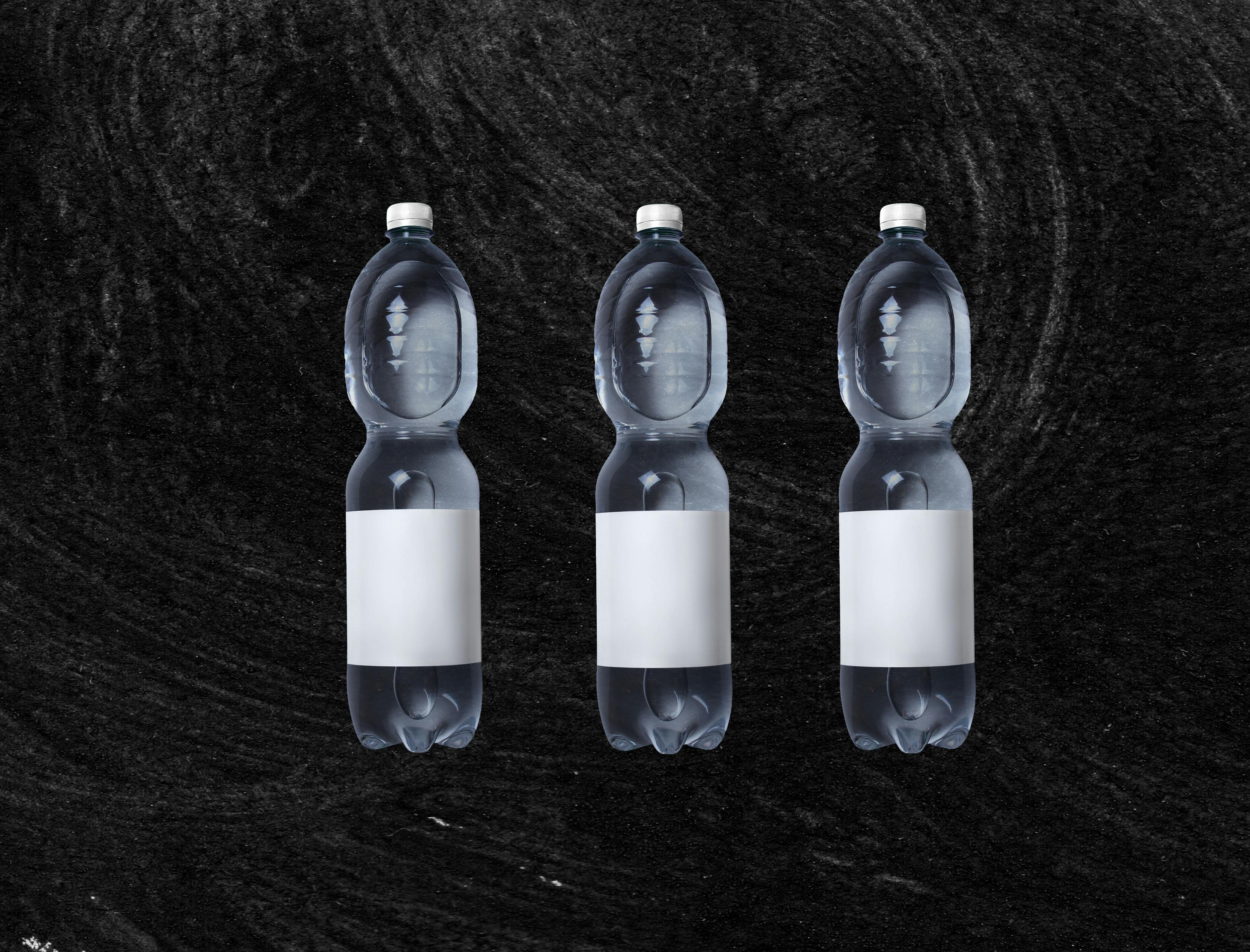 3 Blue Plastic Bottles With White Liquid · Free Stock Photo