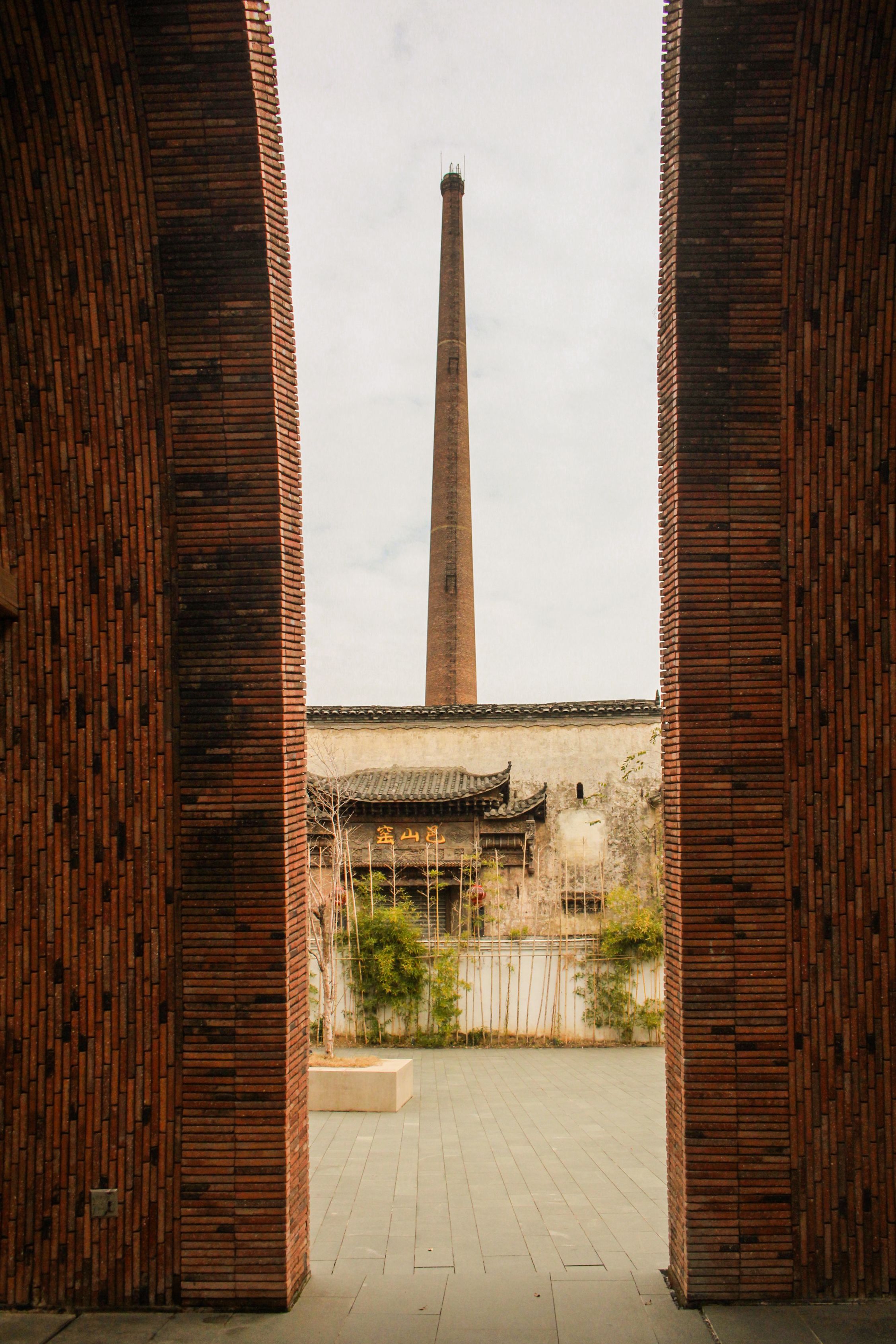 Building and Tower behind Door Opening · Free Stock Photo
