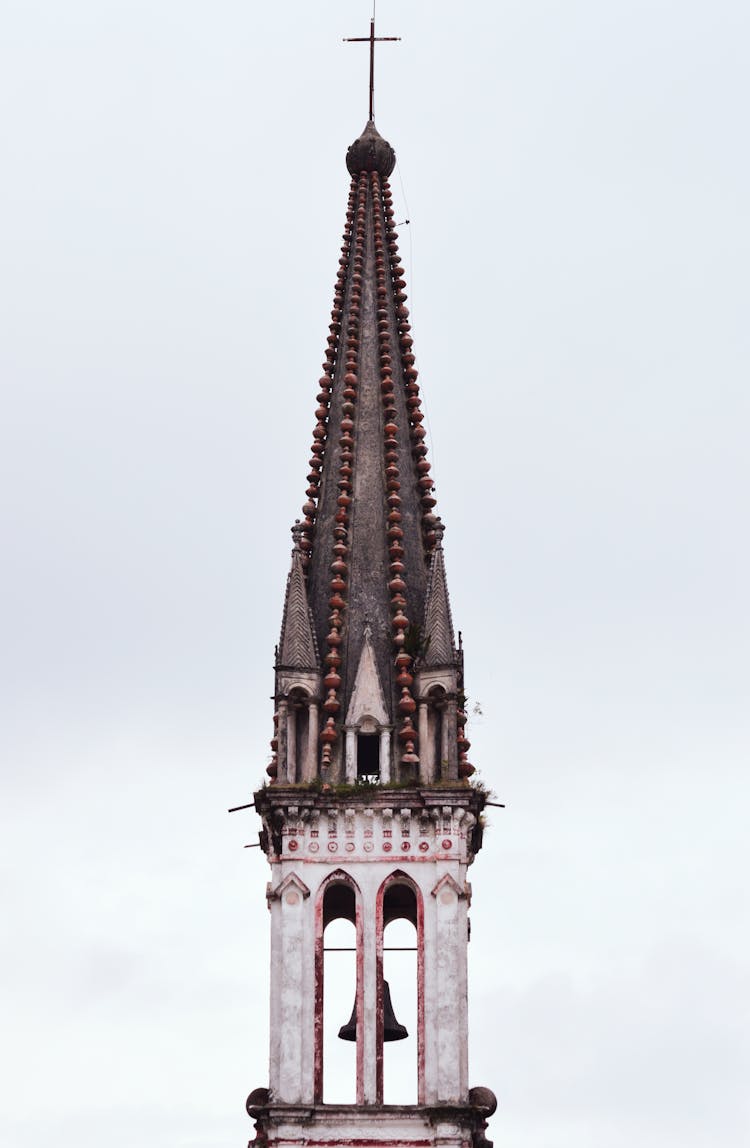 Brown And White Painted Church Bell Tower