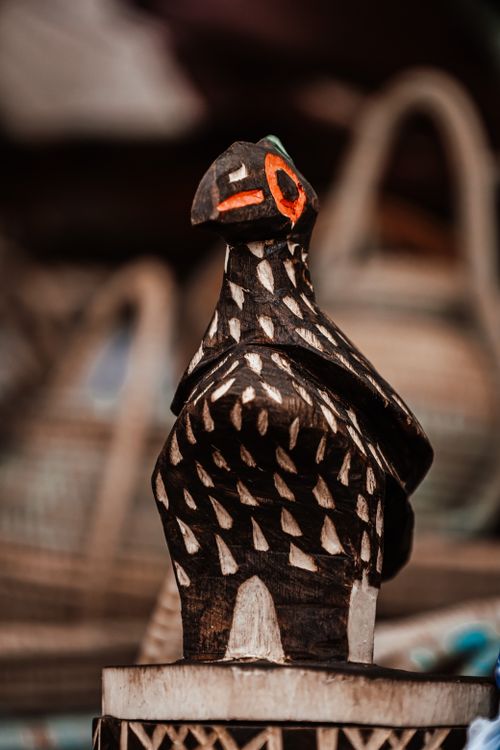 Free Intricately carved wooden bird sculpture showcasing handmade artistry from Angola. Stock Photo