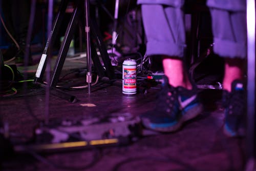 Selective Photo of a Can of Beer on The Floor