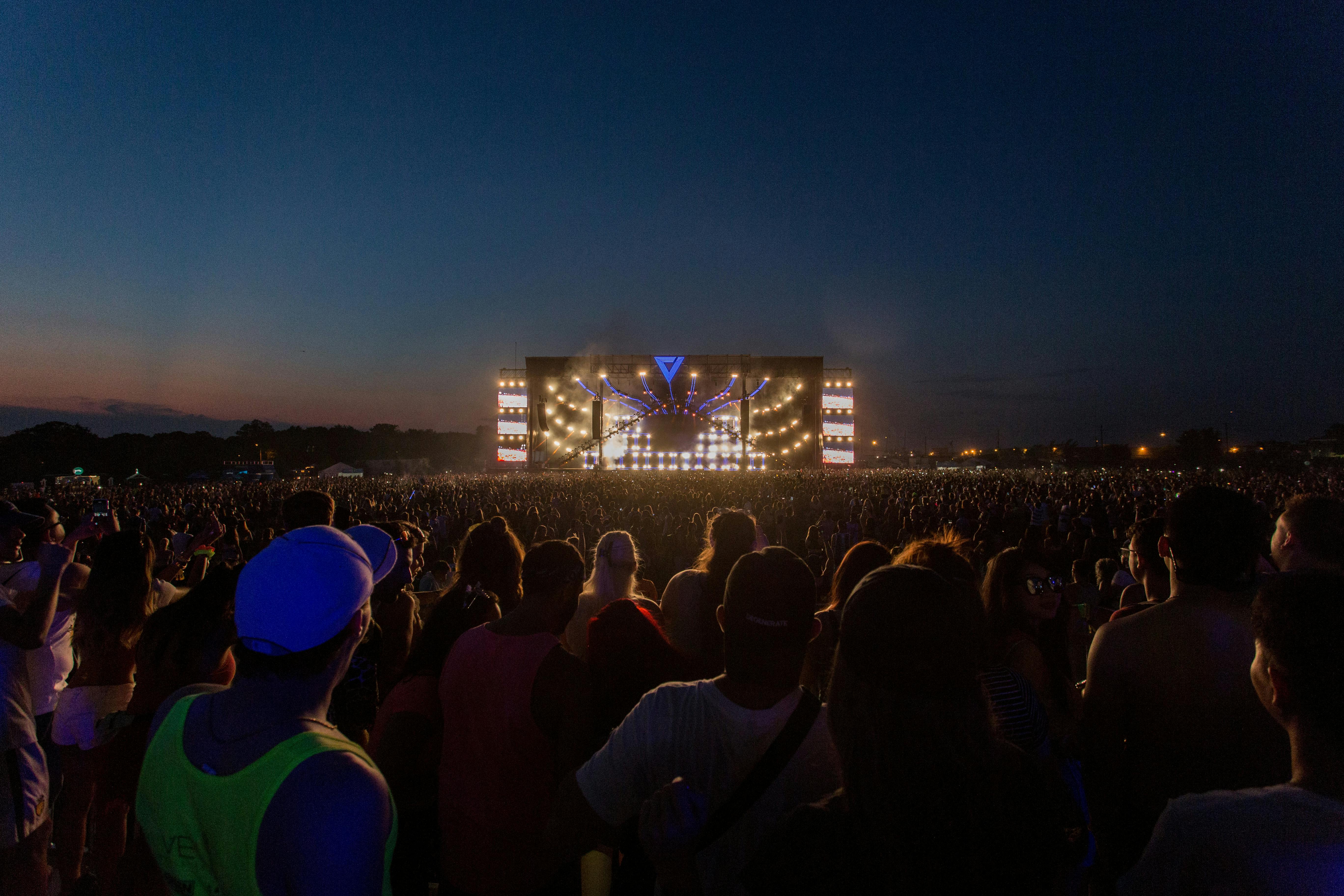 group of person watching concert outdoors