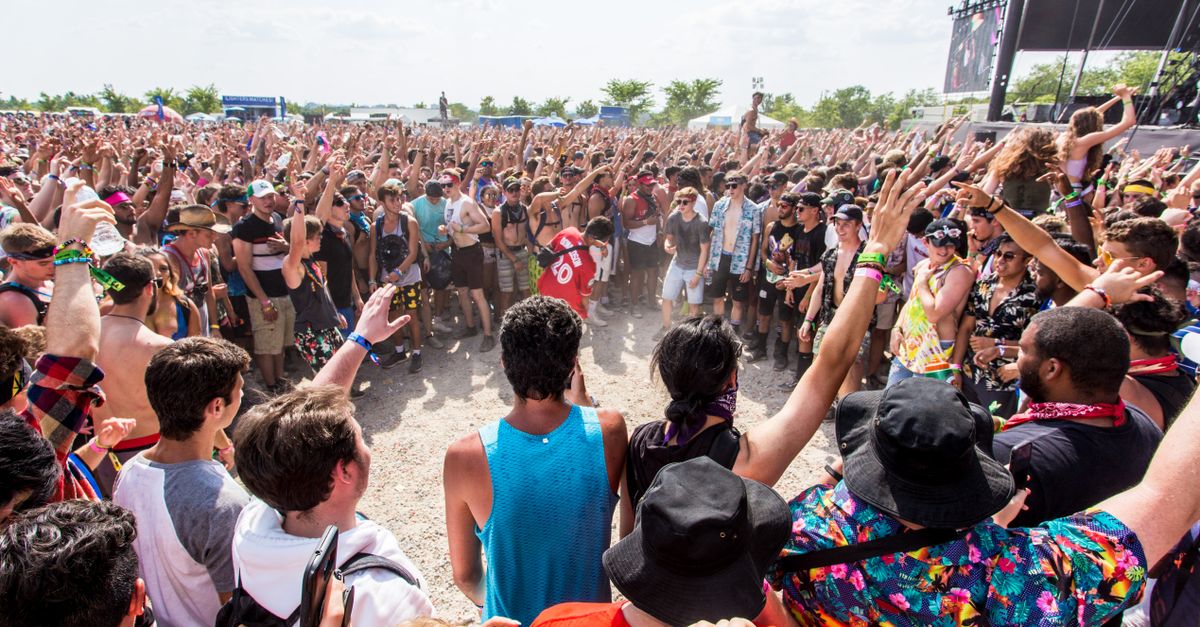 Drake and Kendrick Lamar facing off on a stage with tension in the air