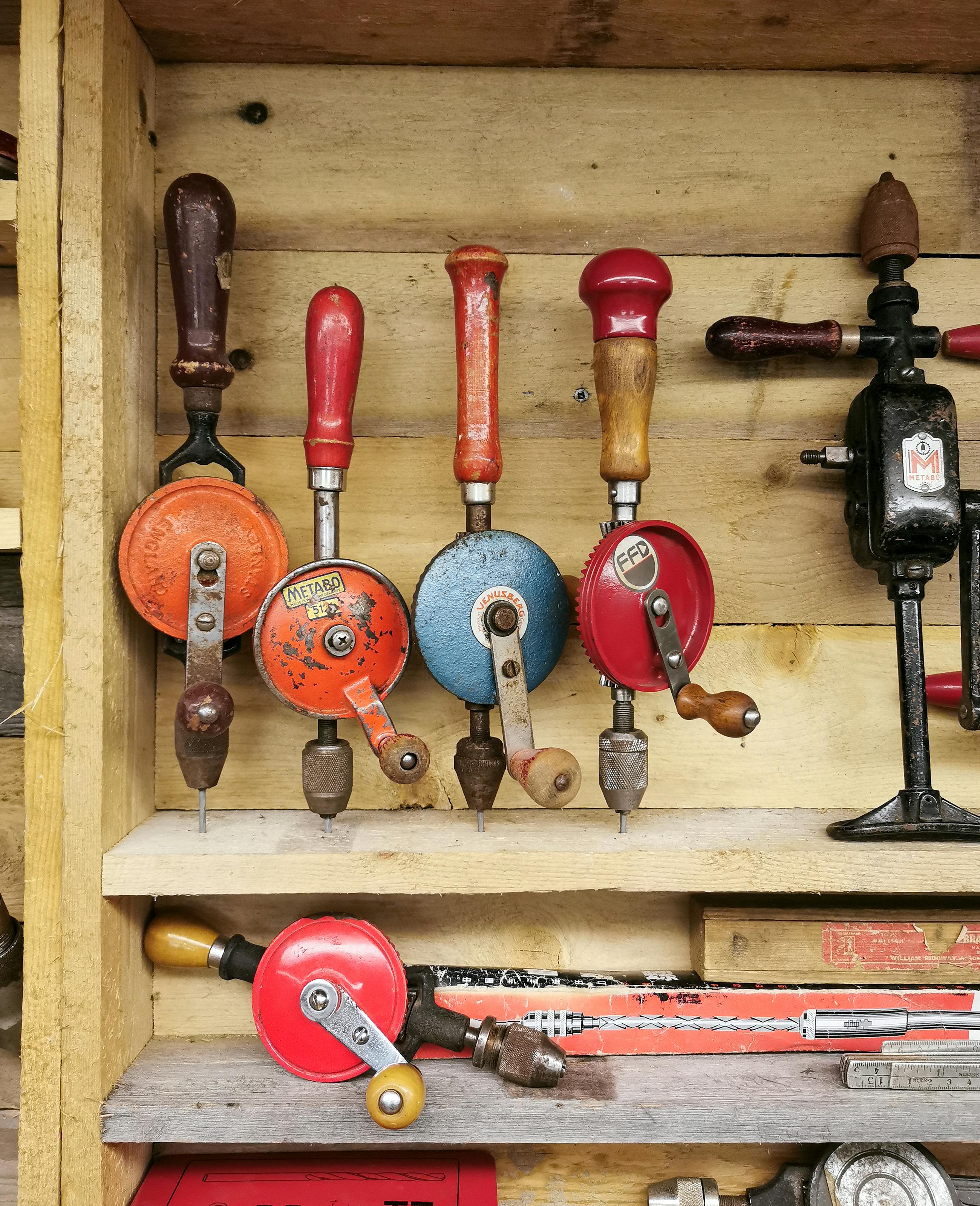 Manual Drills Hanging on Wooden Shelves · Free Stock Photo