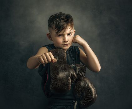 Portrait of Boy with Boxing Gloves