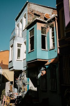 Vibrant urban facade with colorful architecture basking in afternoon sunlight.