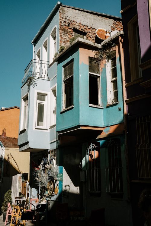 Free Vibrant urban facade with colorful architecture basking in afternoon sunlight. Stock Photo
