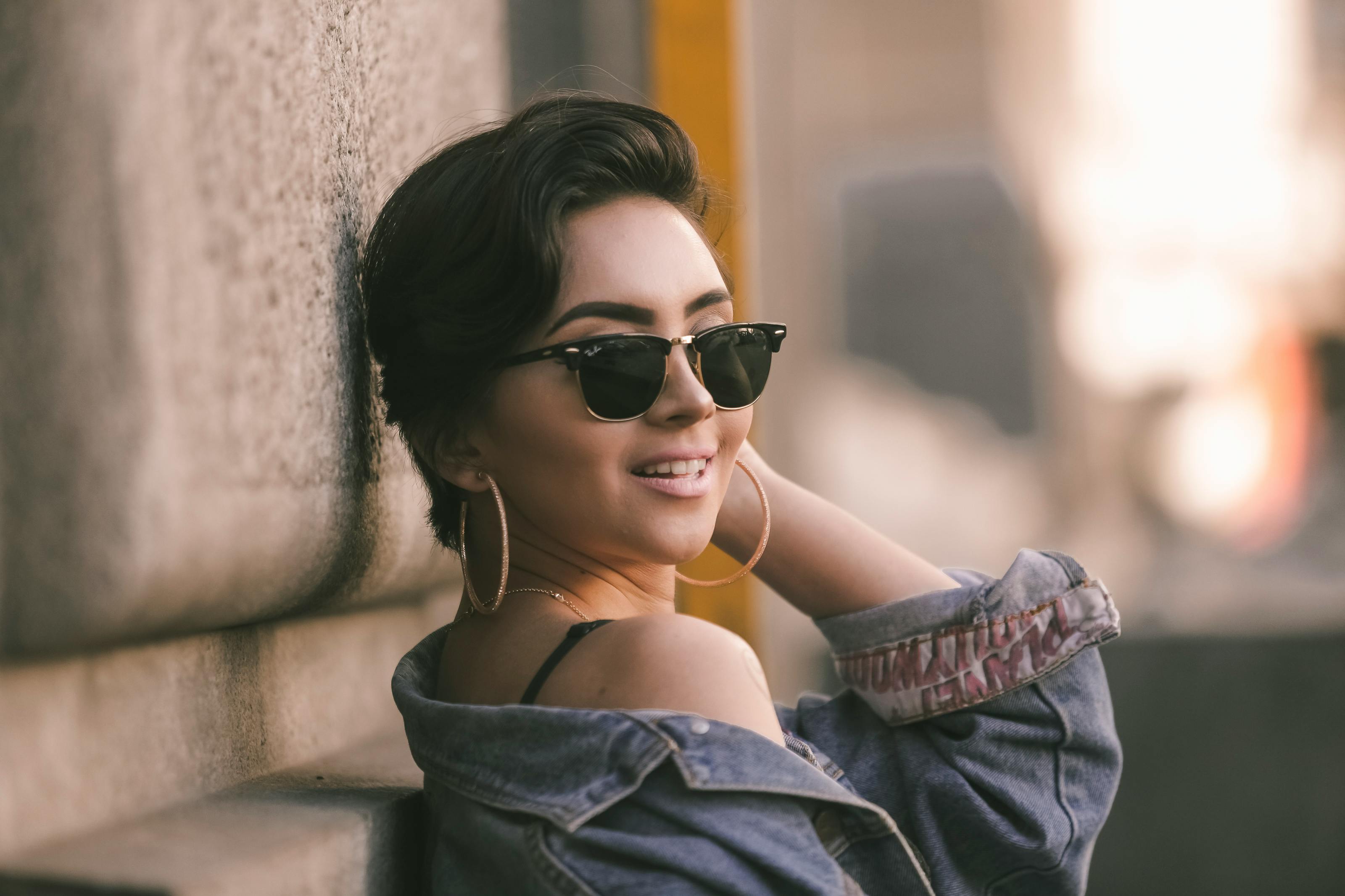 Model in Sunglasses Standing by Wall at Night · Free Stock Photo