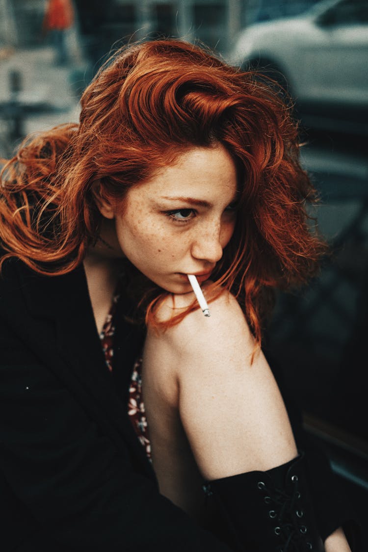 Redhead Woman Smoking Cigarette