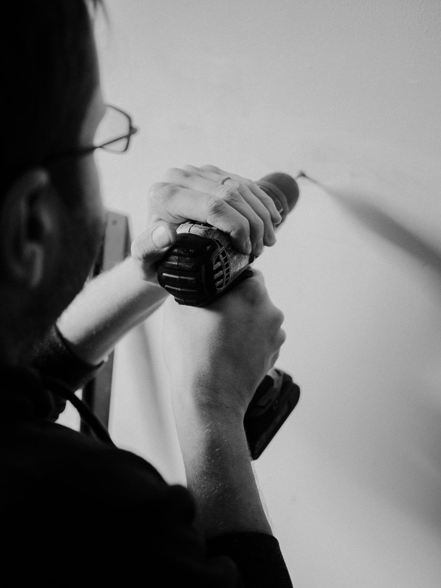 Drilling into a wall to mount a bracket