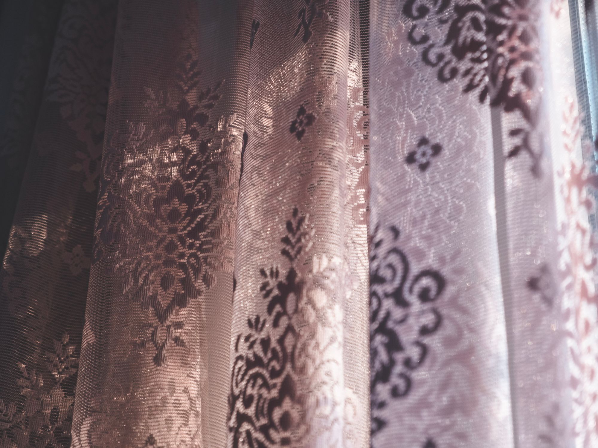 Wallpapering in Hampton Wick, Richmond upon Thames — decorator hanging pattern-matched wallpaper