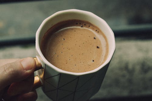 Close-up of Man Holding a Cup of Coffee