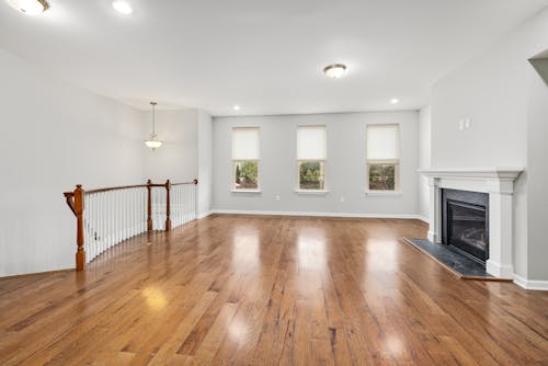 An Unfurnished Room with a Fireplace 