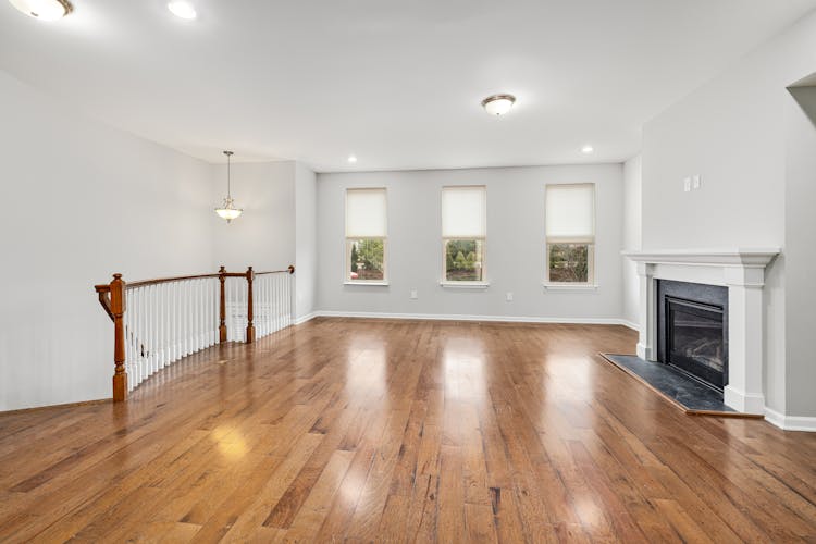 An Unfurnished Room With A Fireplace 