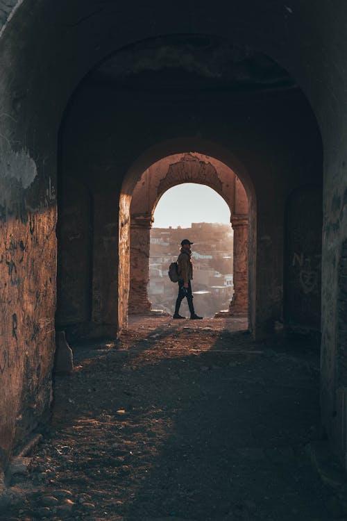 Person Standing in Building's Hallway