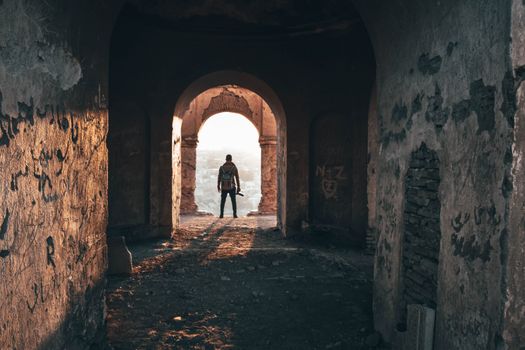 Man Standing On Arc Doorway