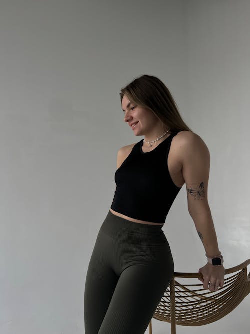 Young Woman in Casual Clothing Standing in a Room 