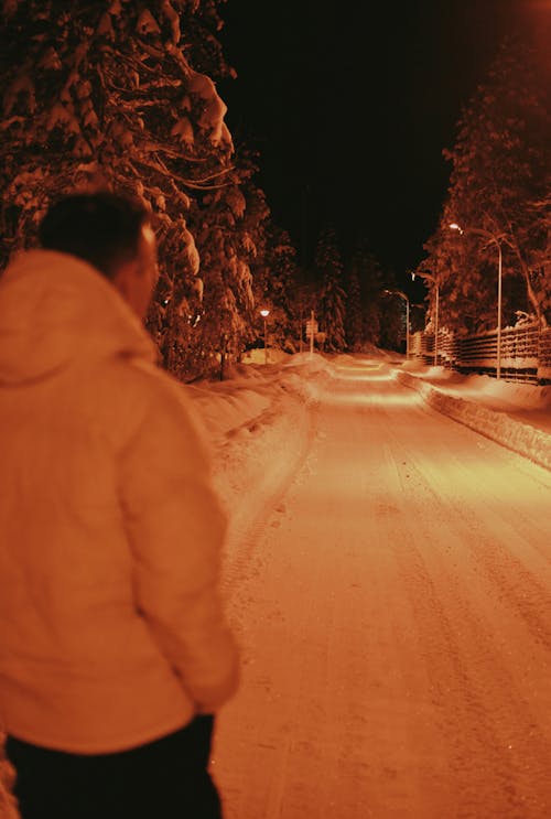 Man Taking a Walk at Dusk in Winter 