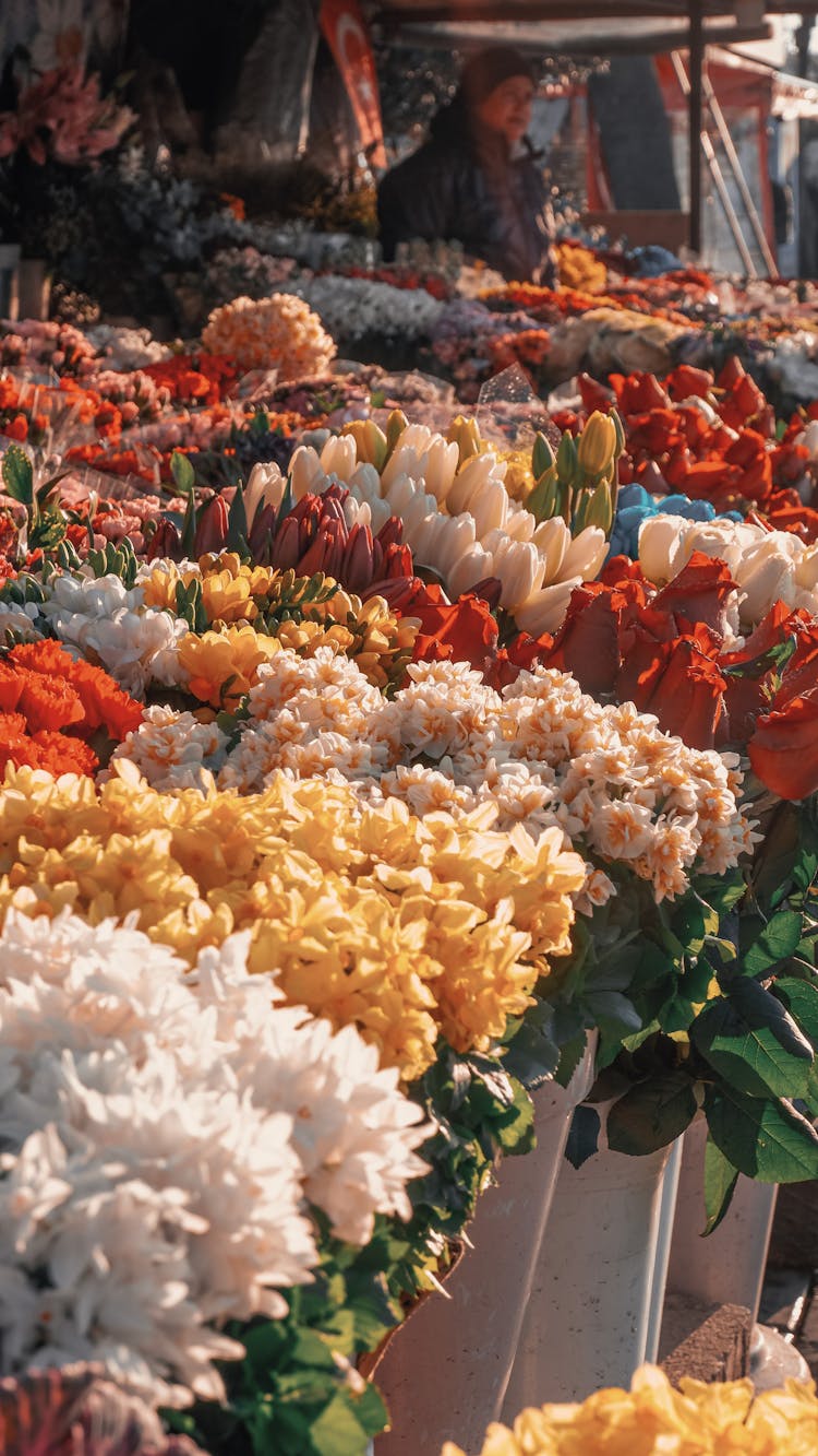 Selling Flowers On Outdoor Market