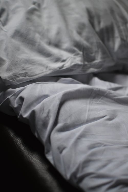 Free Close-up of White Sheets on Bed Stock Photo