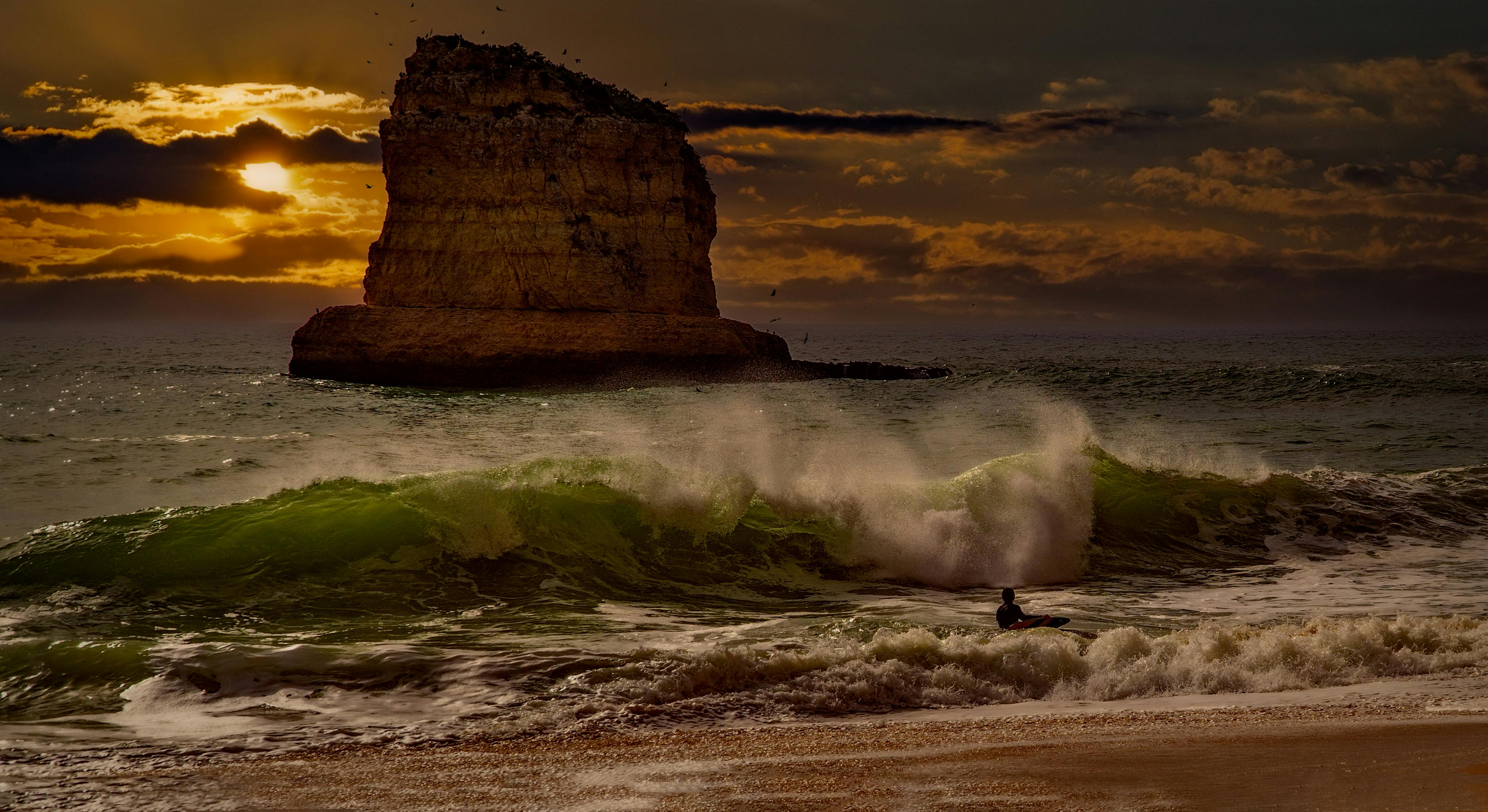 Pacific coast sea stacks with gentle surf, dusk