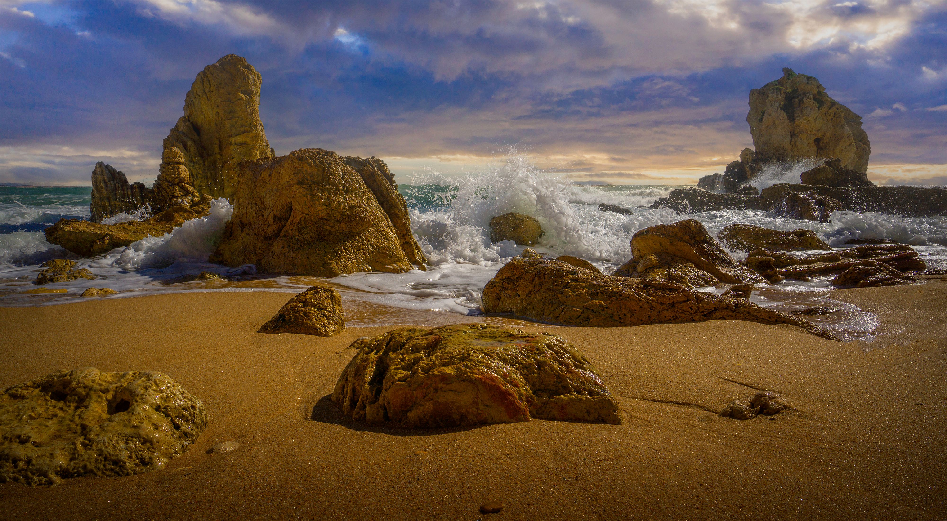 Tide Crashing over Rocks on a Beach · Free Stock Photo