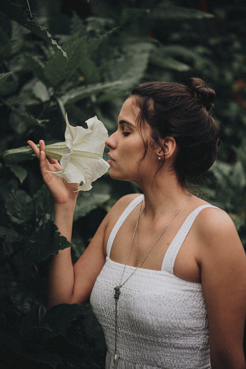Woman Sniffing Flower