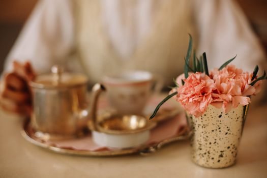 Carnations in a Vase by a Tea Tray