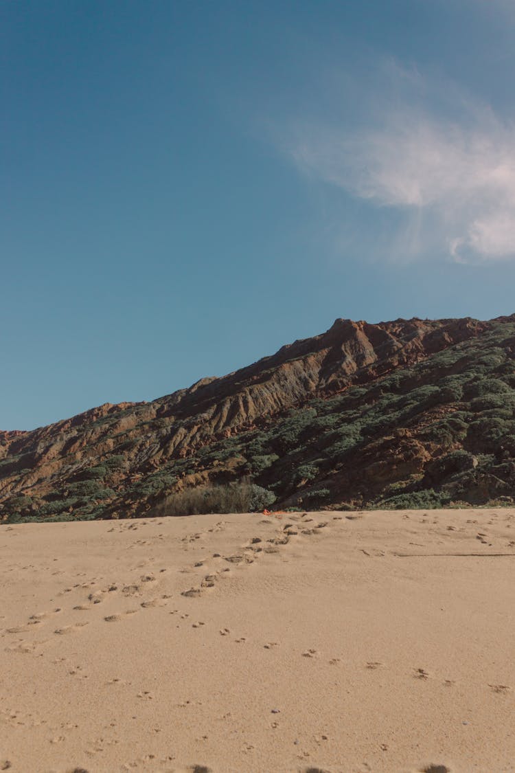 Beach And Hill Behind