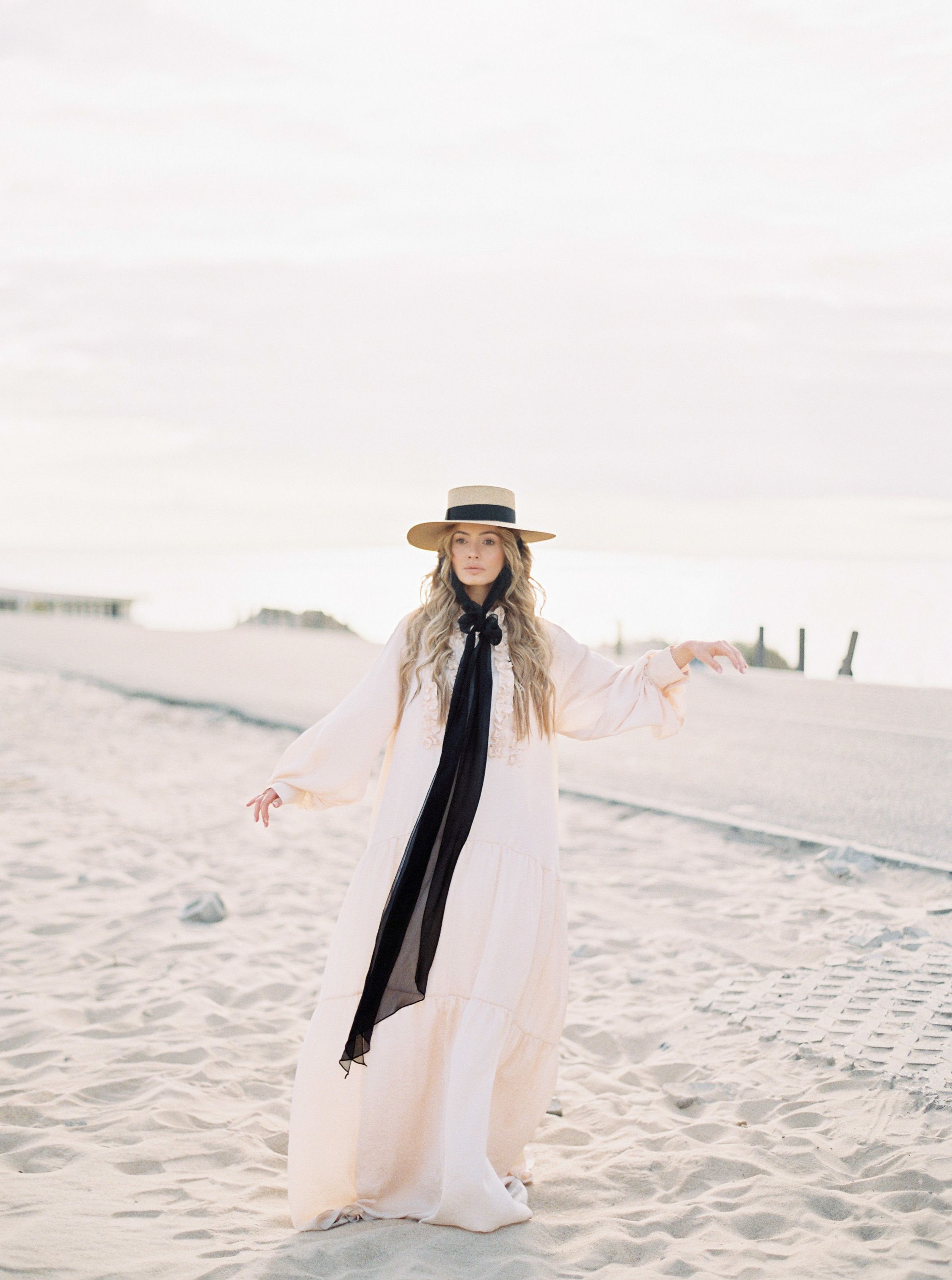 Woman in Long White Dress Standing on the Beach · Free Stock Photo