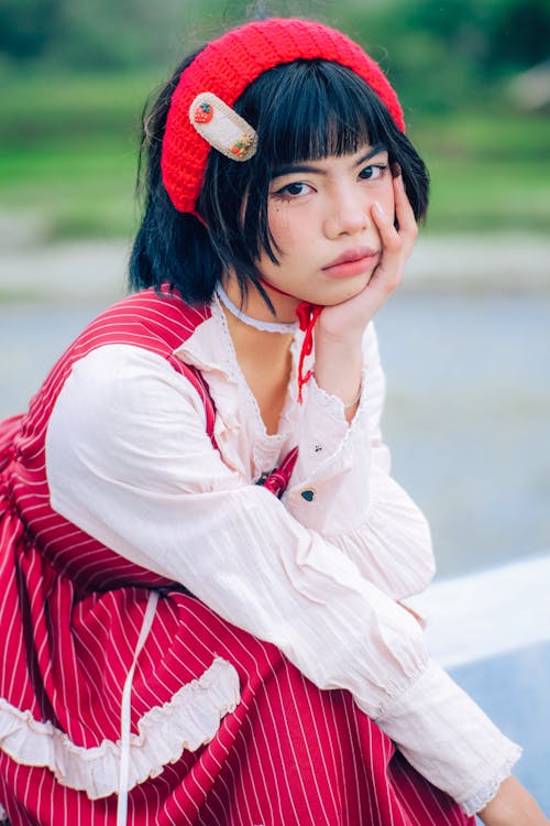 Posed Photo of a Girl in a Red Dress and Headband 