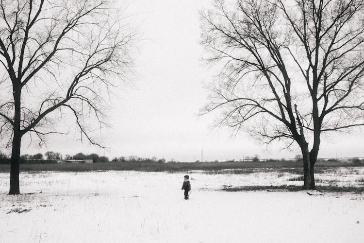 Boy Standing On Snow