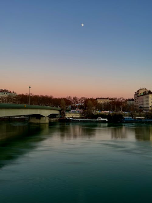Photo of a River in a City at Dusk 