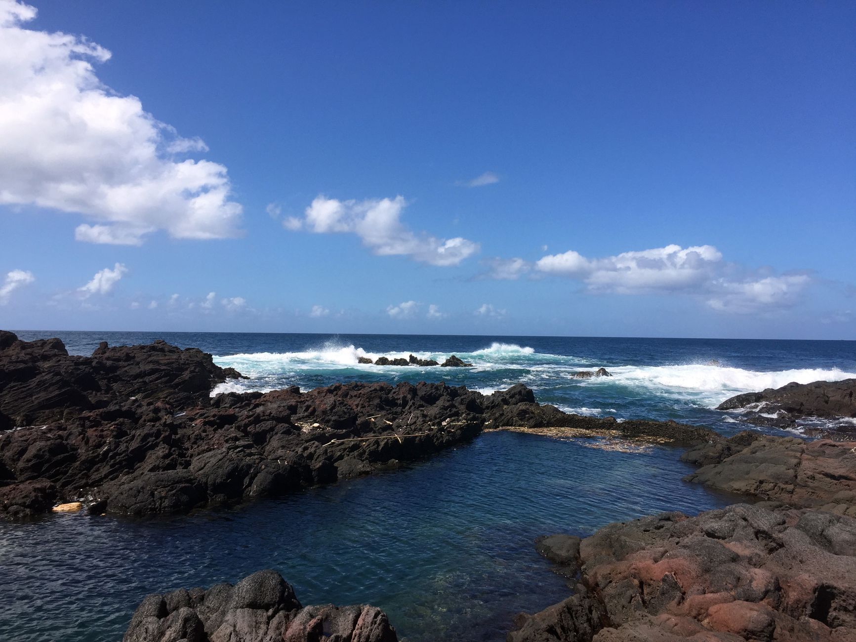 Scenic view of the rocky coast and waves at Ibusuki, Kagoshima, under clear skies.. pexels, scenic, view