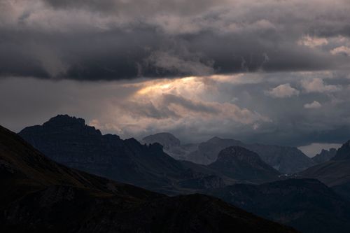 Free A breathtaking view of stormy skies over the Dolomite Mountains in Cortina d'Ampezzo, Italy. Stock Photo