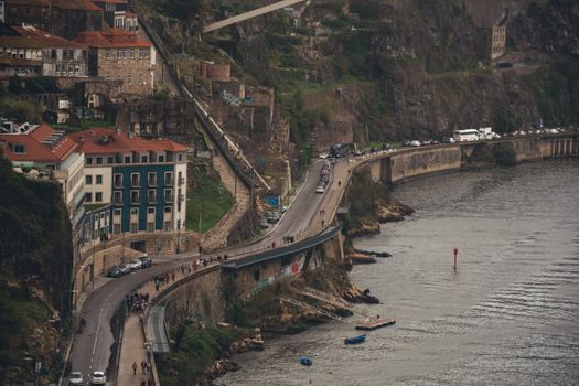 Explore Porto's captivating riverside road with charming architecture and scenic views.