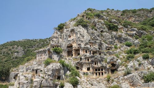 Free Explore the ancient Lycian tombs nestled in Turkey's stunning mountainous terrain. Stock Photo