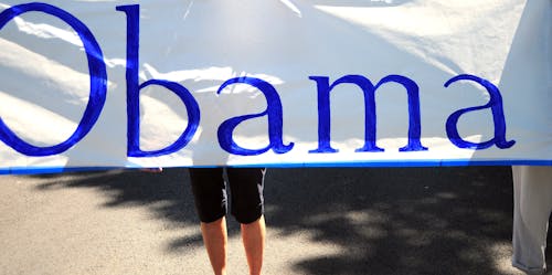 Obama banner displayed outside.