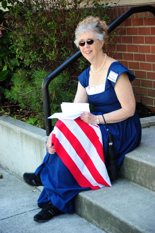 Female holding the usa flag.