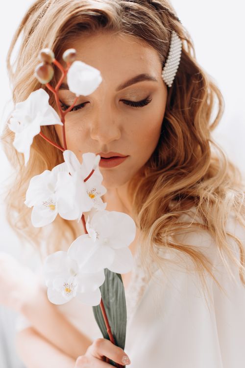 Young Woman with Closed Eyes and White Flower · Free Stock Photo