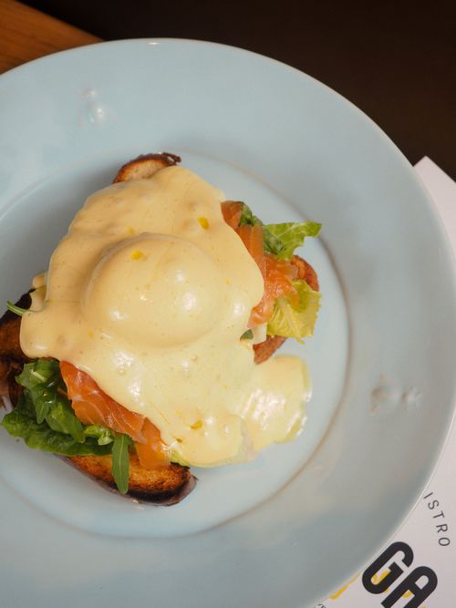 Free Delicious Eggs Benedict with smoked salmon and hollandaise sauce served on toast. Stock Photo