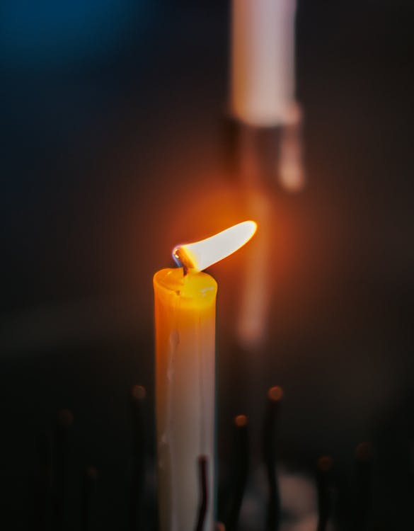 Close-up of a Vertical Candle Burning 