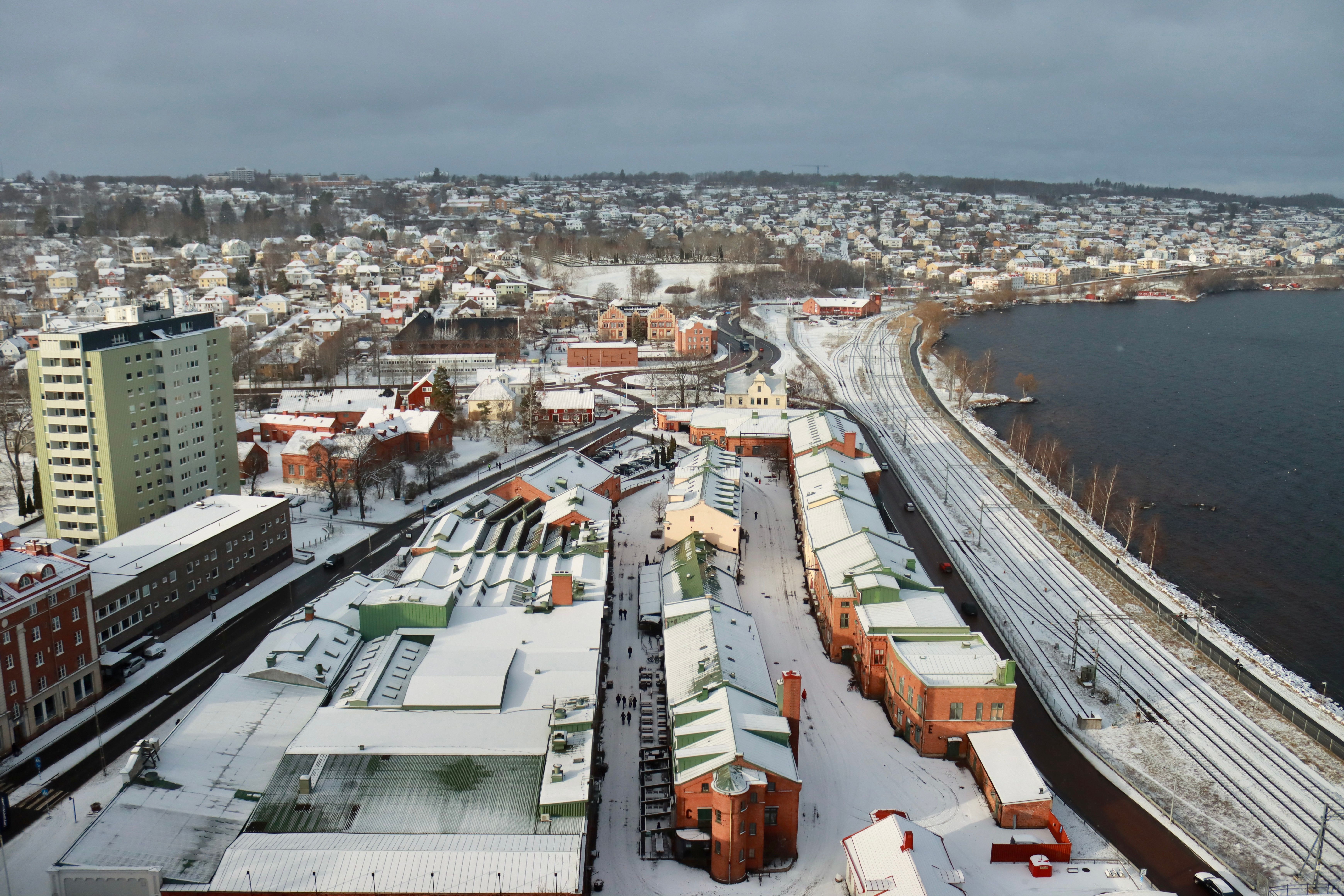 Aerial View of Snow Covered City by Sea Shore · Free Stock Photo