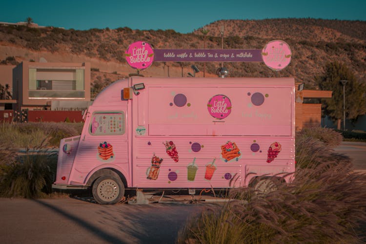 Pink Vintage Food Truck On The Road