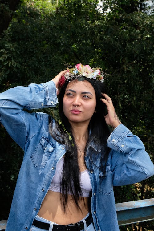 A Woman in a Denim Shirt Wearing a Flower Crown 