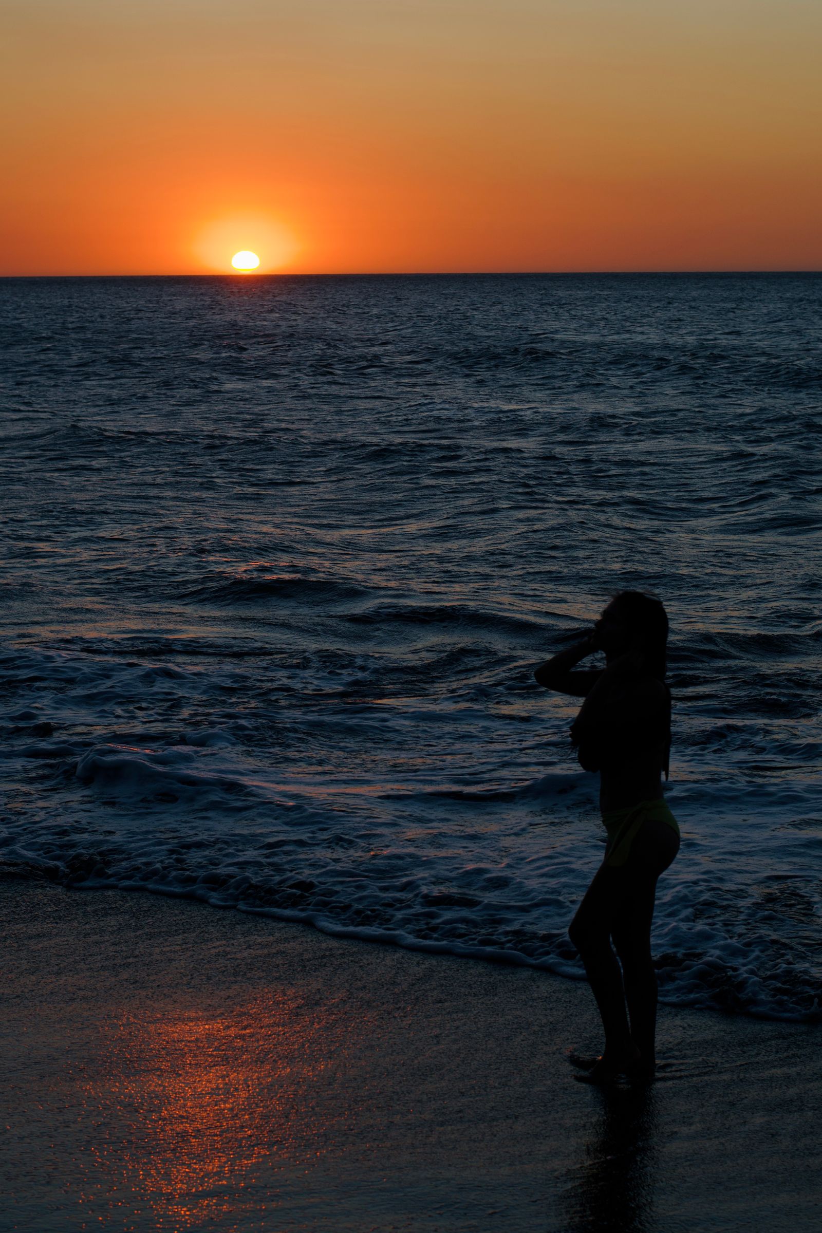 Woman Walking on Beach during Sunset · Free Stock Photo