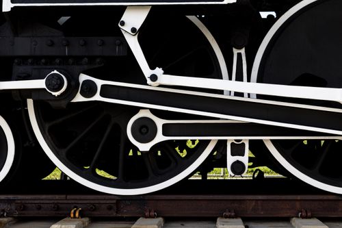 Free A detailed view of classic locomotive wheels and machinery, showcasing vintage engineering. Stock Photo